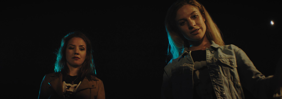 two women from below looking into something