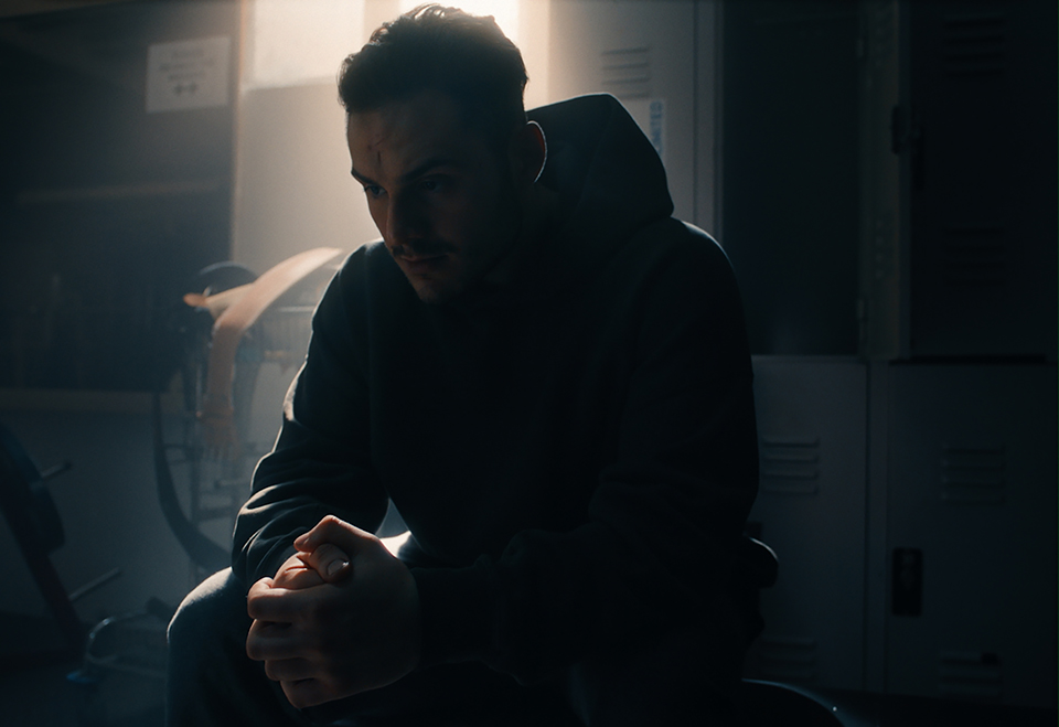 lost in thought man sitting in locker room